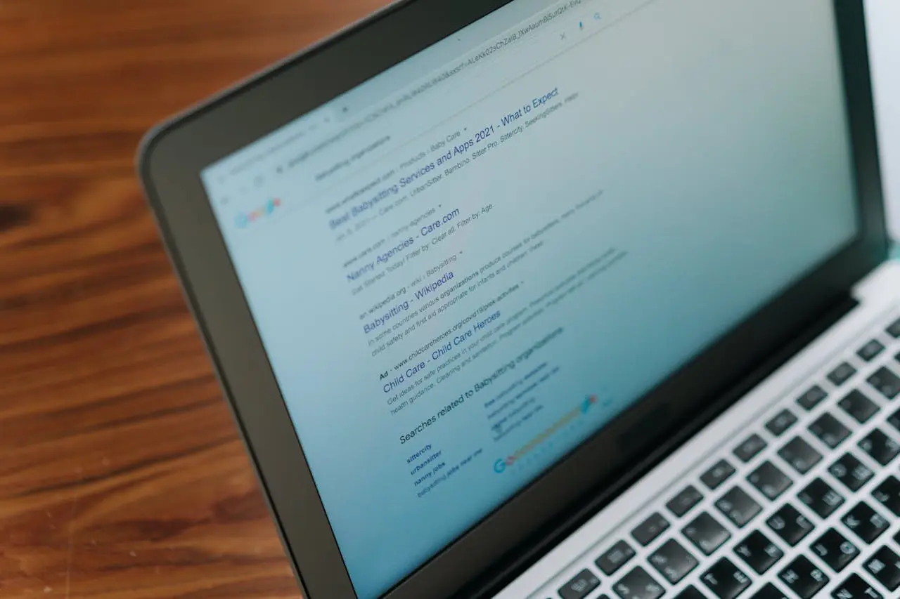 Google Search results on a laptop screen representing SEO optimization for laundromats.